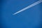 Airliner with Contrails Flying in a Clear Blue Sky