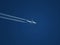 Airliner flying with contrails with blue sky BOSTON UK, February 2020