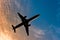 Airliner silhouette against blue sky