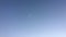 Airplane across clear blue sky