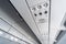 Airplane air conditioning control panel over seats. Stuffy air in aircraft cabin with people. New low-cost airline