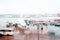 Airplane on the airfield. View through the airport terminal window. Blurred rainy background