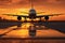 Airplane in the airport at sunset with reflection on the ground. A large jetliner taking landing an airport runway at sunset or