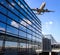 Airplane and airport terminal building