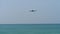 Airplane approaching over ocean