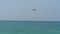 Airplane approaching over ocean