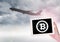 Airplane and Bitcoin icon on tablet in hand