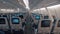 Airplane cabin with aisle and empty seats of economy class