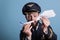 Airplane captain holding jet model and paper plane
