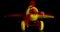 Airplane children's toy.Filmed in a dark key.Macro shot a children's toy red airplane with yellow wings and