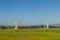 Airplane control tower on the green grass field with blue sky background