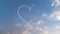 Airplane draws Heart shape on the sky