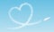 Airplane flies a cloud heart in front of blue sky