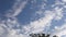 Airplane flies overhead on blue sky