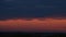 Airplane flies to the landing strip at sunset