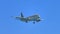 Airplane flying in blue cloudless sky, international passenger carrier, airline