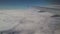 Airplane flying into the clouds. view through an airplane window. traveling