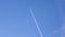 Airplane flying on deep blue sky with chemical vapor trails,tourism transport