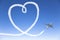 Airplane flying with the heart shape