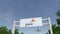 Airplane flying over advertising billboard with PricewaterhouseCoopers PwC logo. Editorial 3D rendering 4K clip