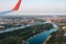 Airplane flying over Belgrade cityscape in Serbia