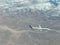 Airplane flying over the clouds. A large white plane.