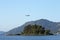 Airplane flying over Mouse island Corfu