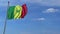 Airplane flying over waving flag of Senegal