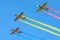 Airplane formation aerobatic team `Iacarii acrobati` IAC 52 aiplanes - Romanian flag colors smoke