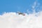 Airplane of the  Iberia, International Airlines Group IAG flying at the end of the state of alarm over a blanket of clouds and a