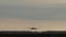 Airplane landing in airport in evening