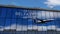 Airplane landing at Belfast Ireland airport mirrored in terminal