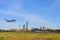 Airplane landing in Buenos Aires at the city airport, skyscrapers of Puerto Madero in the background, Argentina