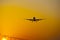 Airplane landing at frankfurt airport at sunrise