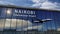 Airplane landing at Nairobi mirrored in terminal