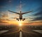 Airplane landing to airport runway in sunset light