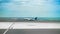 Airplane in Lanzarote airport runaway with sea on the background