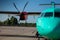 Airplane medium-range turboprop passenger aircraft. Plane at the Airport. Cockpit close up. Runway. Propeller. Turbine