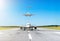 Airplane moves down the runway after landing in the background in the sky turn from passenger aircraft calling at landing at the a