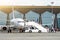 Airplane is parked at the airport with a gangway waiting for boarding of passengers.