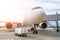 Airplane is parked at the airport with a gangway waiting for boarding of passengers.