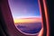 Airplane porthole at sunrise