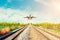 Airplane and railway at sunset. Travel or Transporttation background concept.
