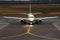 Airplane on a runway preparing for take-off in the airport, aviation business