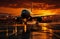 An airplane is on the runway at sunset. A large jetliner sitting on top of an airport tarmac