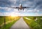 Airplane and rural road at sunset