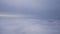 Airplane shot, flying in haze clouds over europe