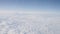 Airplane shot, flying over white clouds over europe