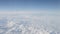 Airplane shot, flying over white clouds over europe