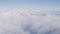 Airplane shot, flying over white clouds over europe